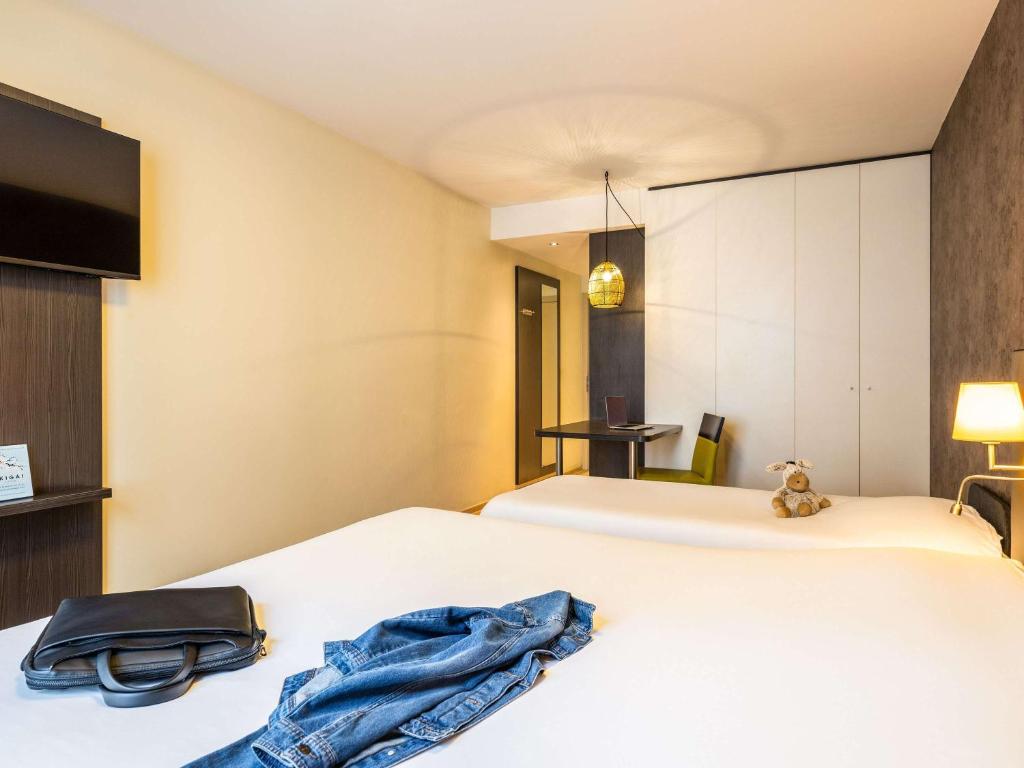 Postel nebo postele na pokoji v ubytování ibis Styles Hotel Brussels Centre Stéphanie