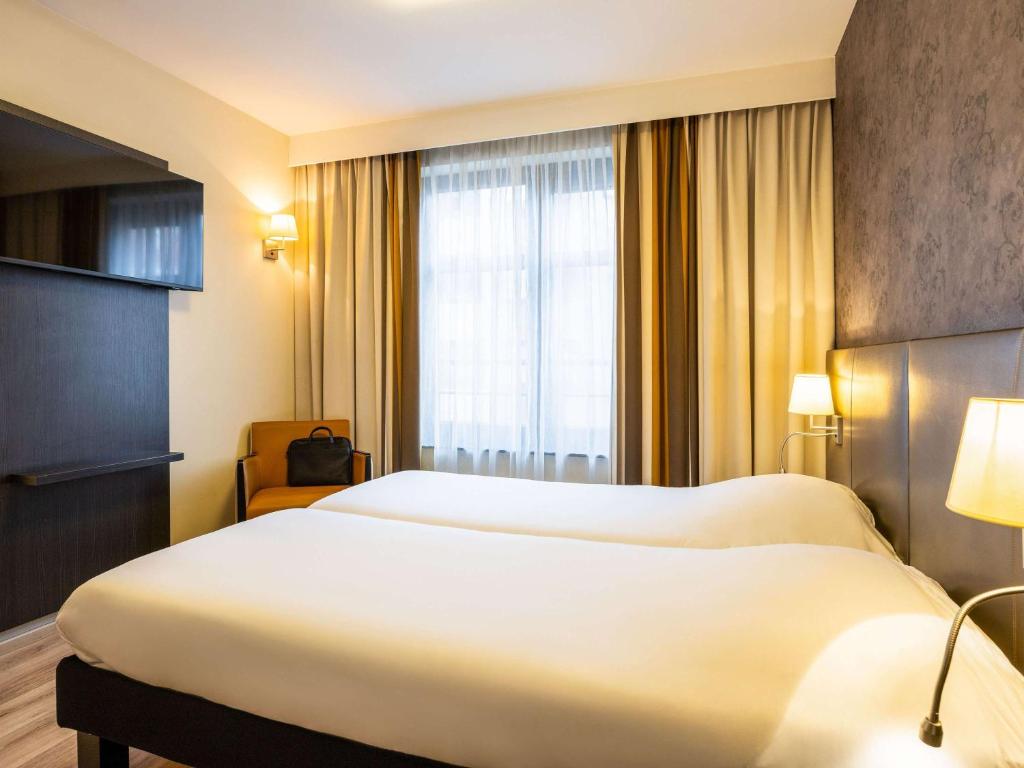 Postel nebo postele na pokoji v ubytování ibis Styles Hotel Brussels Centre Stéphanie