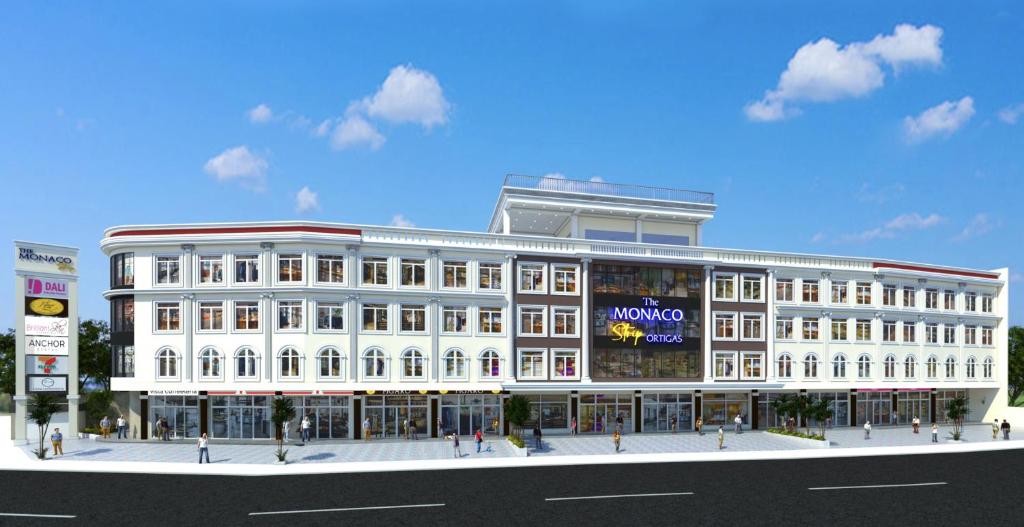 a rendering of a large white building on a street at Monaco Hotel in Taytay