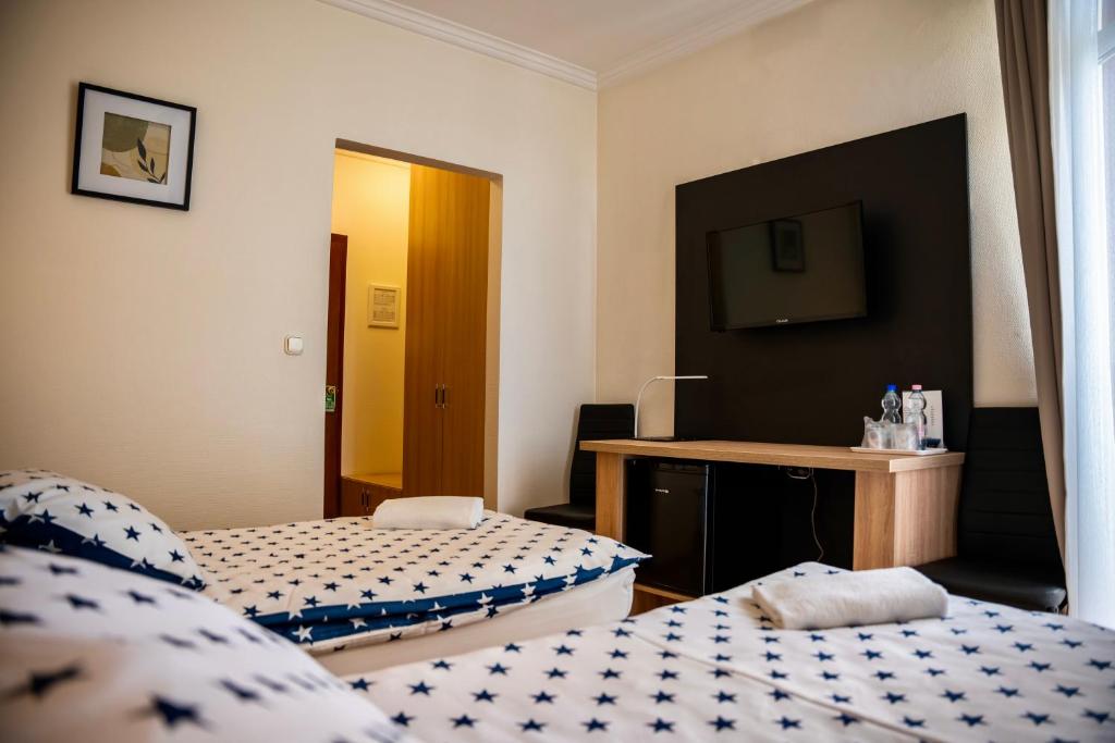 Postel nebo postele na pokoji v ubytování Hotel Bolero