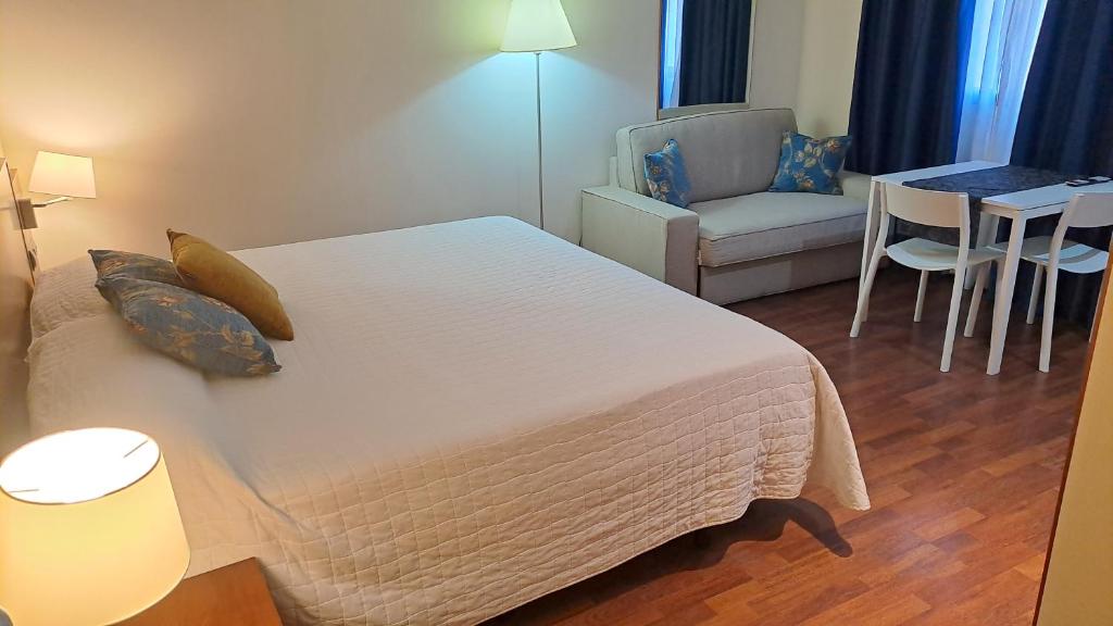 Postel nebo postele na pokoji v ubytování Hotel Suite Camarena