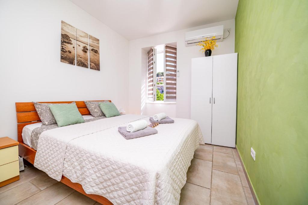 Posteľ alebo postele v izbe v ubytovaní SkyGarden House