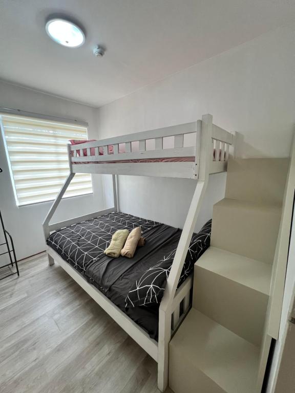 Postel nebo postele na pokoji v ubytování Lan’z cozy 2 bedroom 8 spatial maa