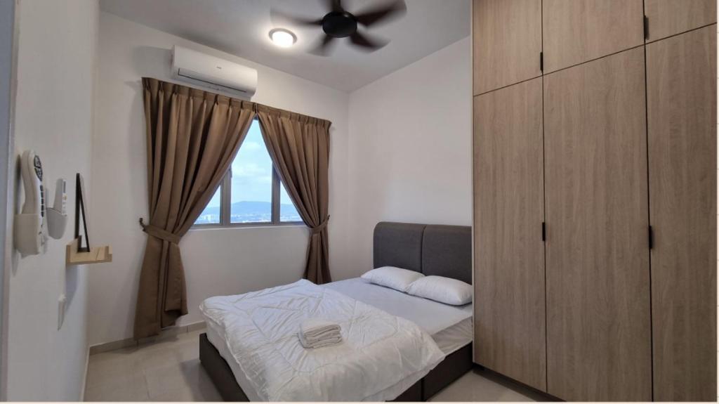 Ένα ή περισσότερα κρεβάτια σε δωμάτιο στο HIY Homestay Adelia2 Bangi