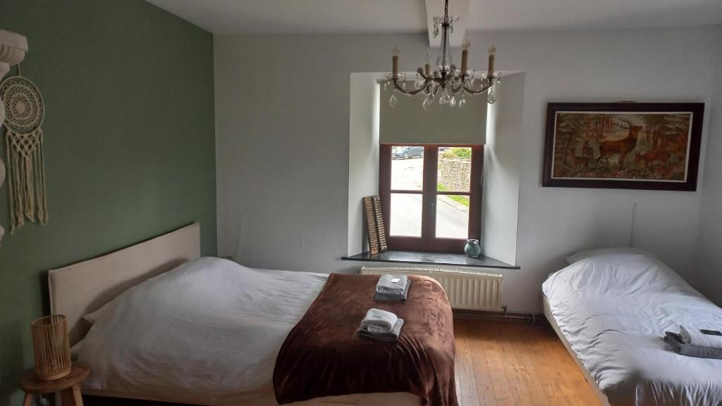 Postel nebo postele na pokoji v ubytování B&B Ferme1883