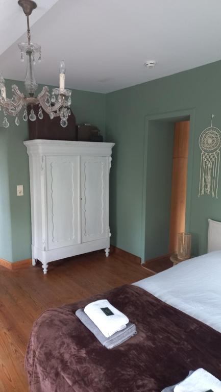 Postel nebo postele na pokoji v ubytování B&B Ferme1883