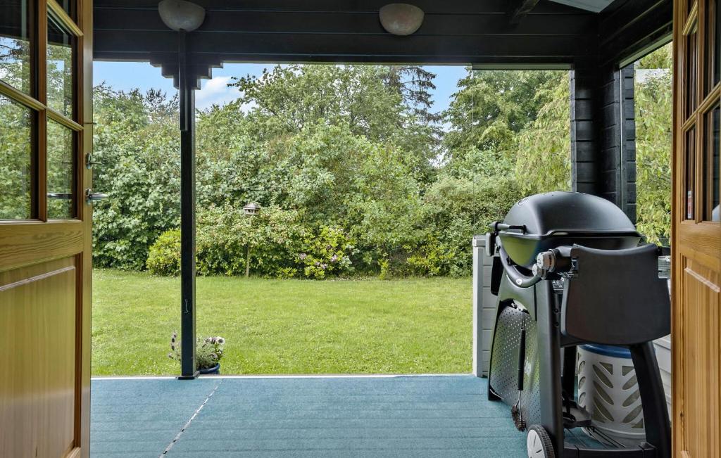 a scooter parked in the doorway of a house at 3 Bedroom Cozy Home In Eskebjerg in Eskebjerg