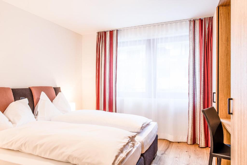 Postel nebo postele na pokoji v ubytování Titlis Resort