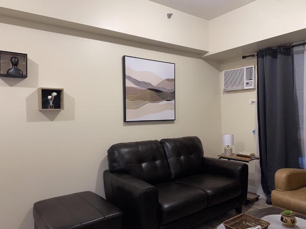 Posezení v ubytování Avida Riala 1BR unit- IT Park Cebu City