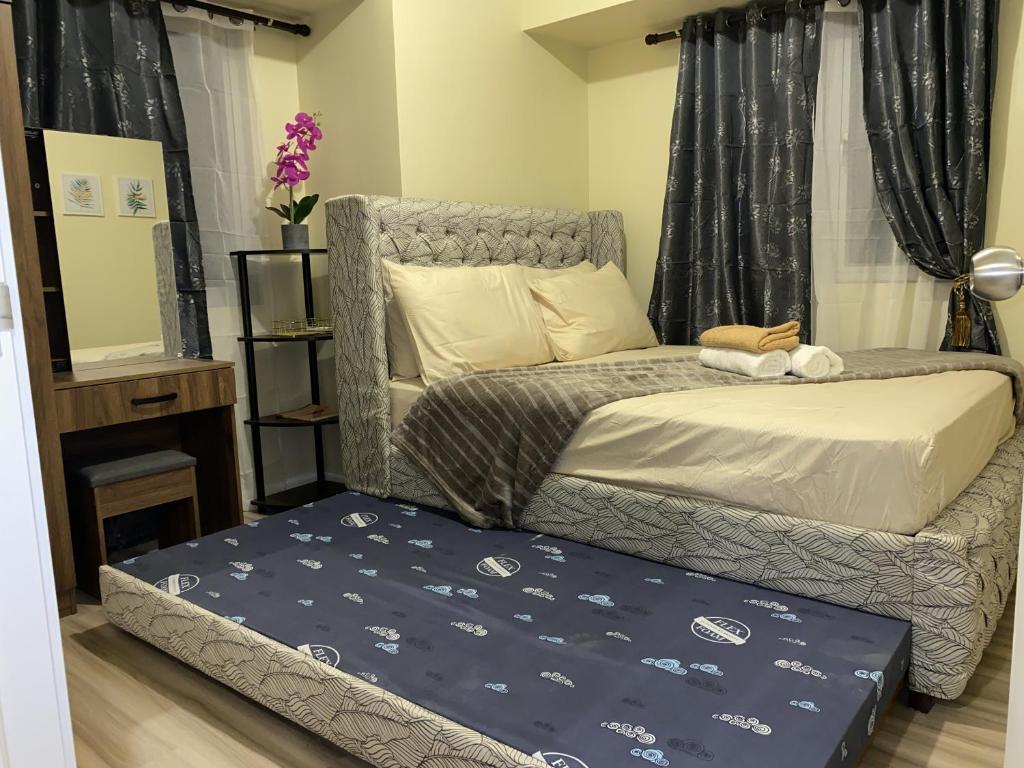 Postel nebo postele na pokoji v ubytování Avida Riala 1BR unit- IT Park Cebu City