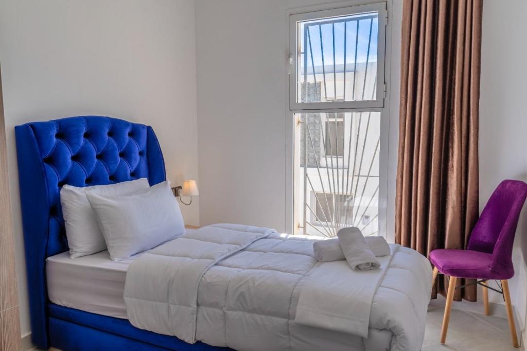 Postel nebo postele na pokoji v ubytování Dakhla Golden Sands