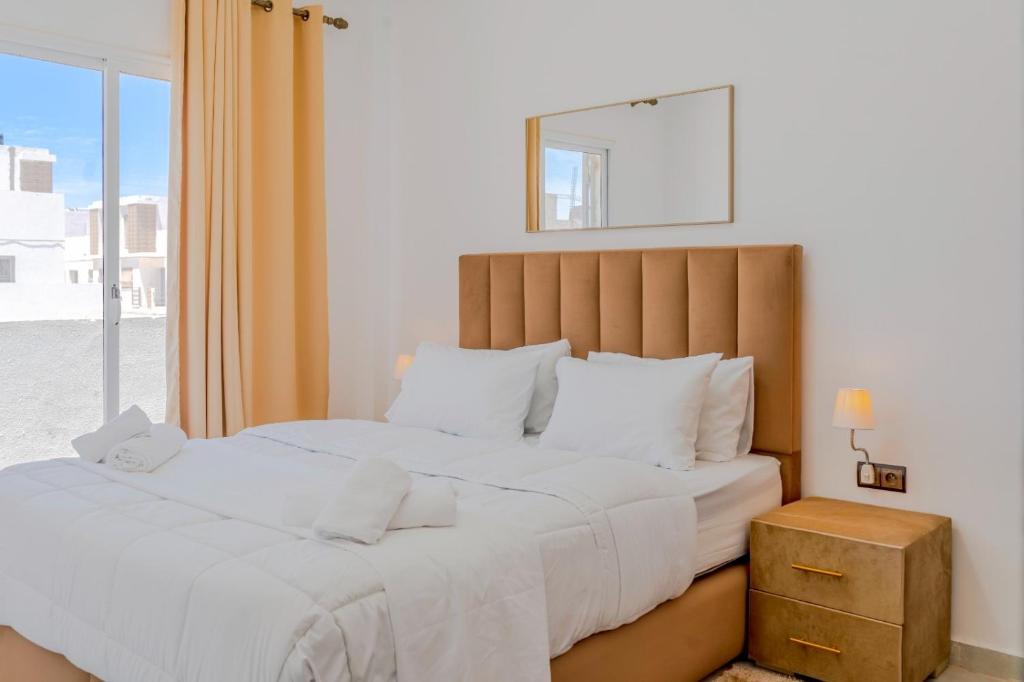 Postel nebo postele na pokoji v ubytování Dakhla Golden Sands