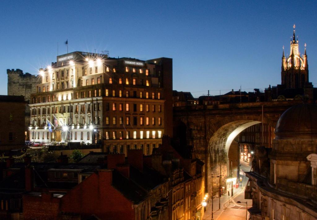 a view of a city at night with a clock tower at The Vermont Hotel & Vermont Aparthotel in Newcastle upon Tyne