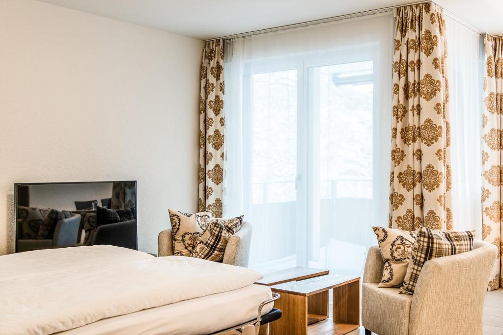 Postel nebo postele na pokoji v ubytování Titlis Resort