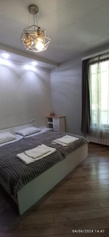 Postel nebo postele na pokoji v ubytování Apartments Lezzet
