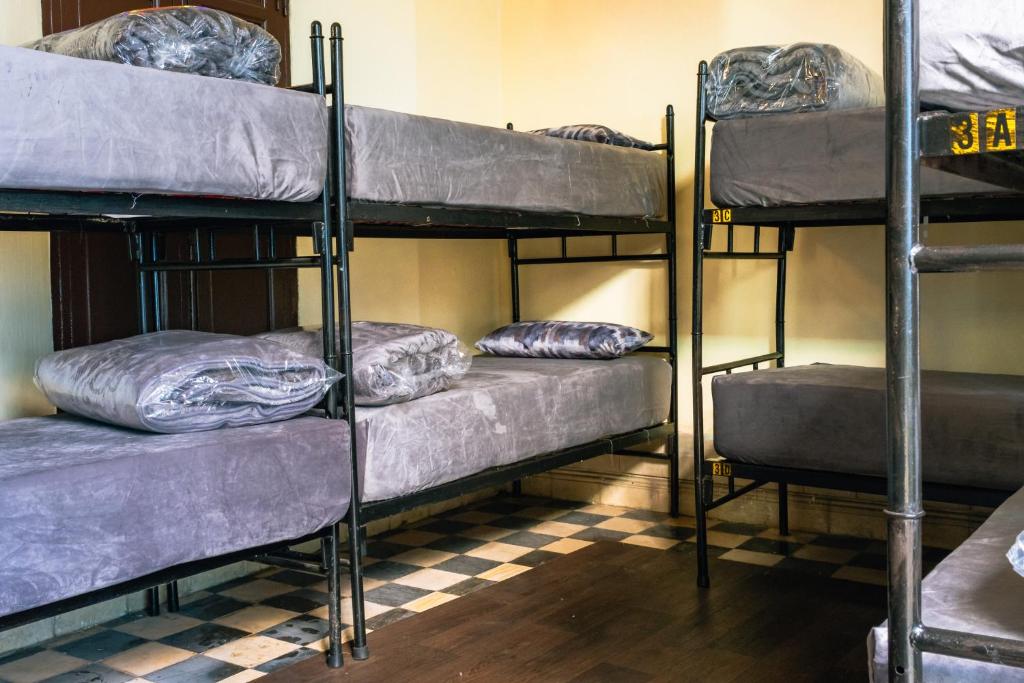 Postel nebo postele na pokoji v ubytování Auberge De Jeunesse