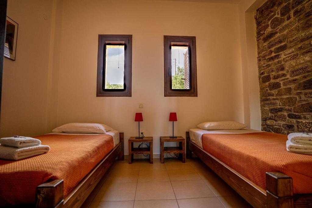 Postel nebo postele na pokoji v ubytování Chara House
