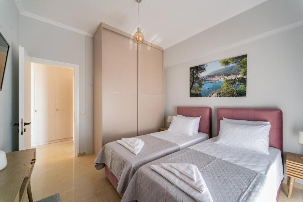 Postel nebo postele na pokoji v ubytování Lengo D Home II
