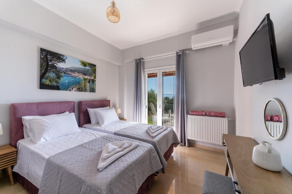 Postel nebo postele na pokoji v ubytování Lengo D Home II