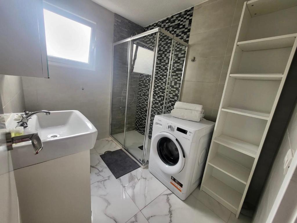A bathroom at New big flat with balcony 50mts away from beach Parking Optional