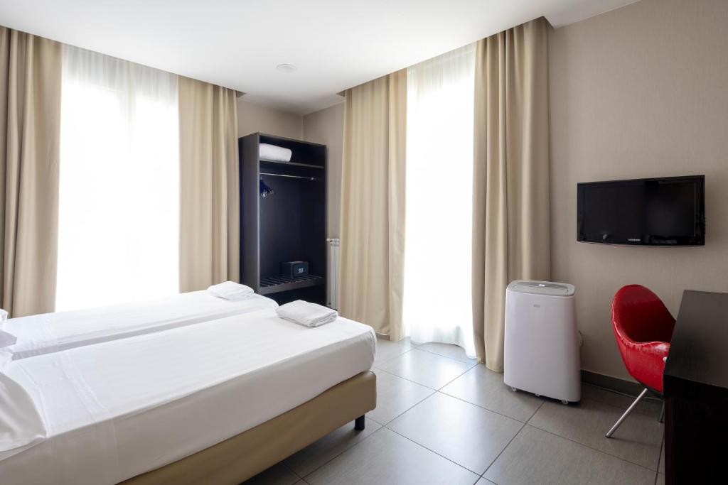 Postel nebo postele na pokoji v ubytování Napolit'amo Hotel Medina