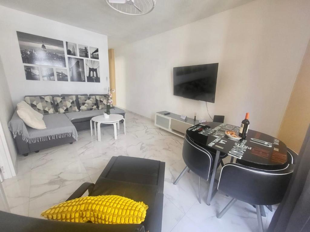A television and/or entertainment centre at New big flat with balcony 50mts away from beach Parking Optional