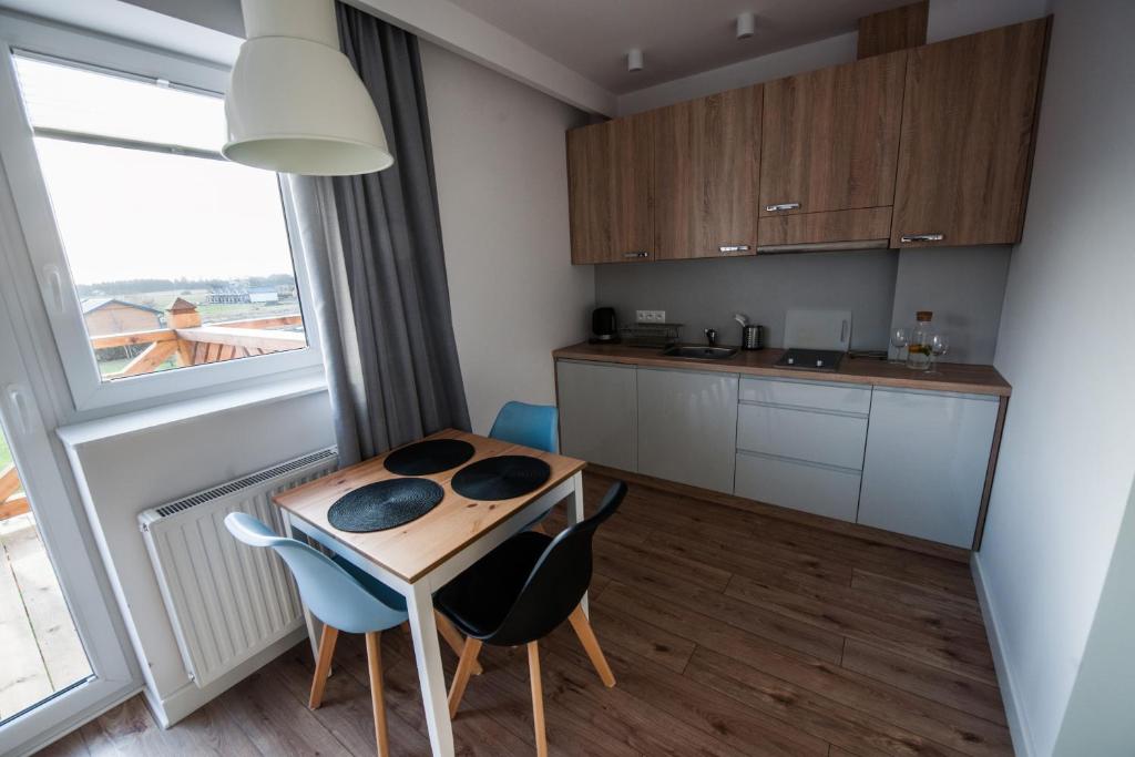 Kuchyň nebo kuchyňský kout v ubytování Lazur Apartamenty Domki