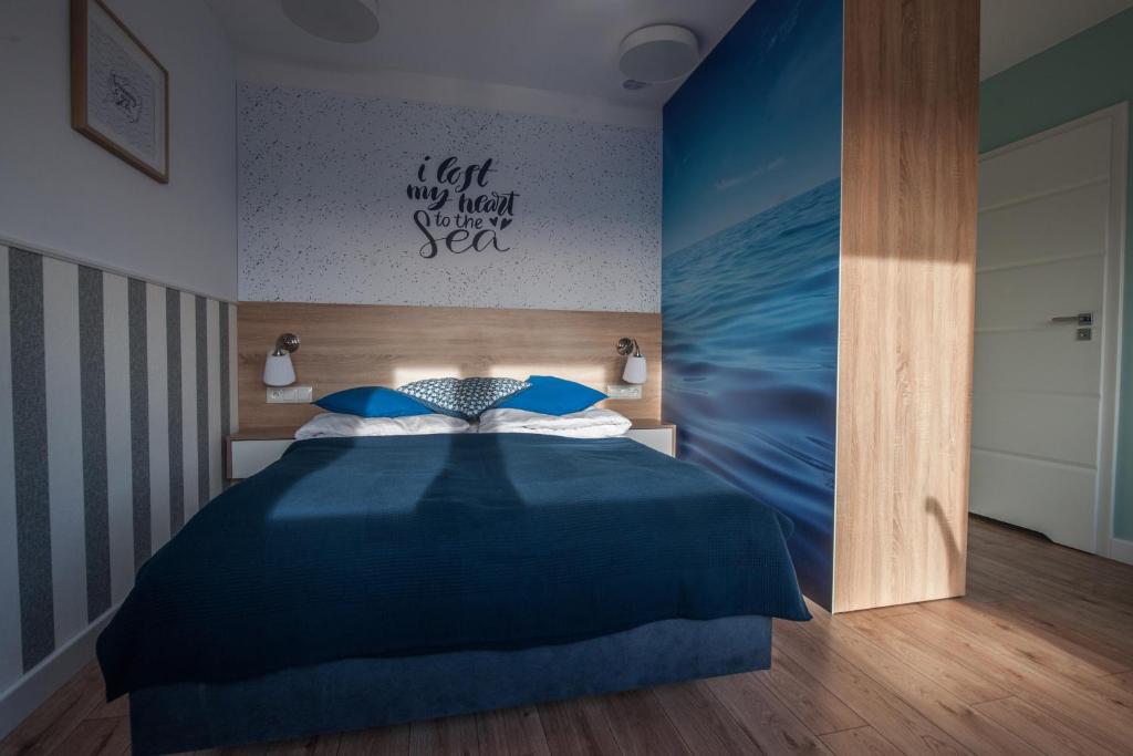 Postel nebo postele na pokoji v ubytování Lazur Apartamenty Domki