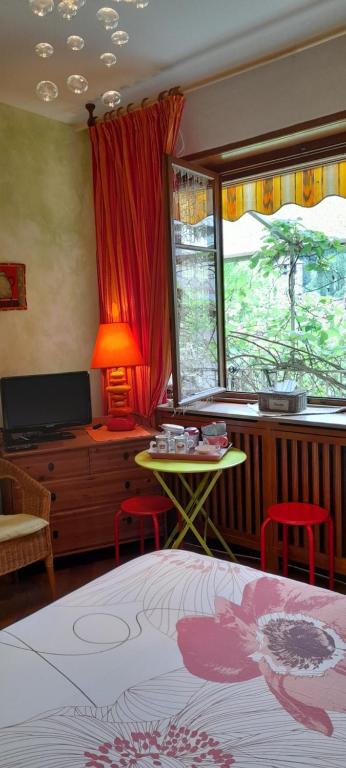 Postel nebo postele na pokoji v ubytování Appartements & Chambres Les Loges du Capucin