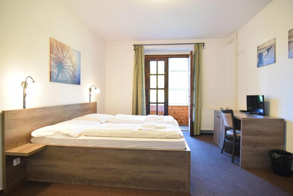 Postel nebo postele na pokoji v ubytování Hotel Konšel