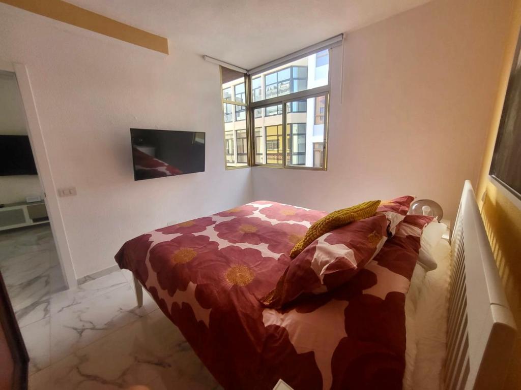 A television and/or entertainment centre at New big flat with balcony 50mts away from beach Parking Optional