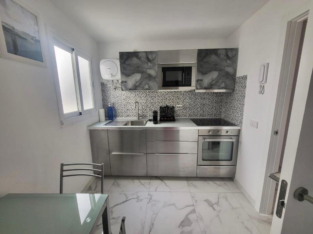 A kitchen or kitchenette at New big flat with balcony 50mts away from beach Parking Optional