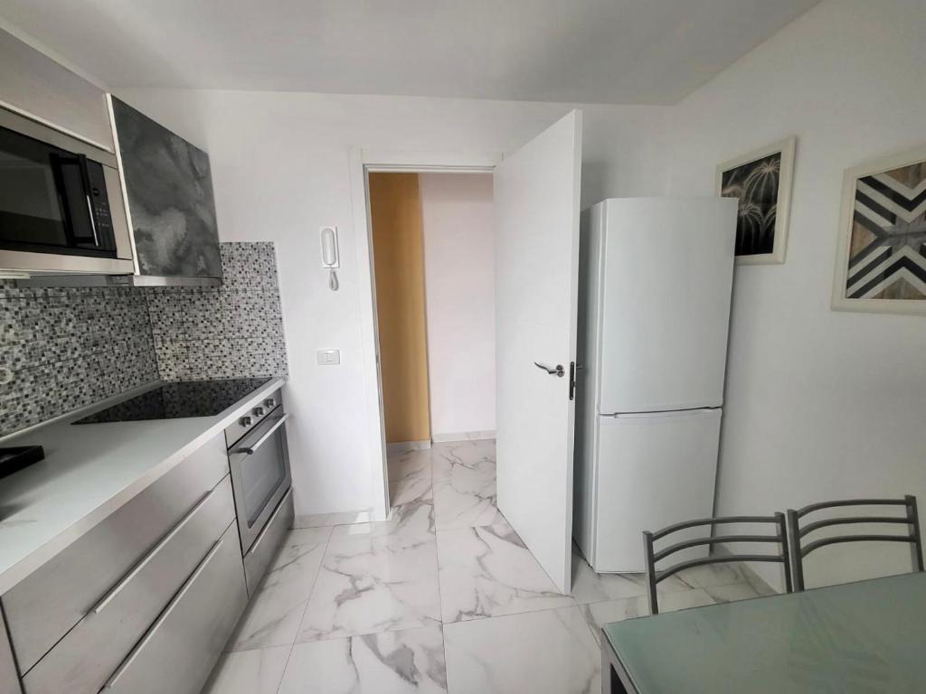 A kitchen or kitchenette at New big flat with balcony 50mts away from beach Parking Optional