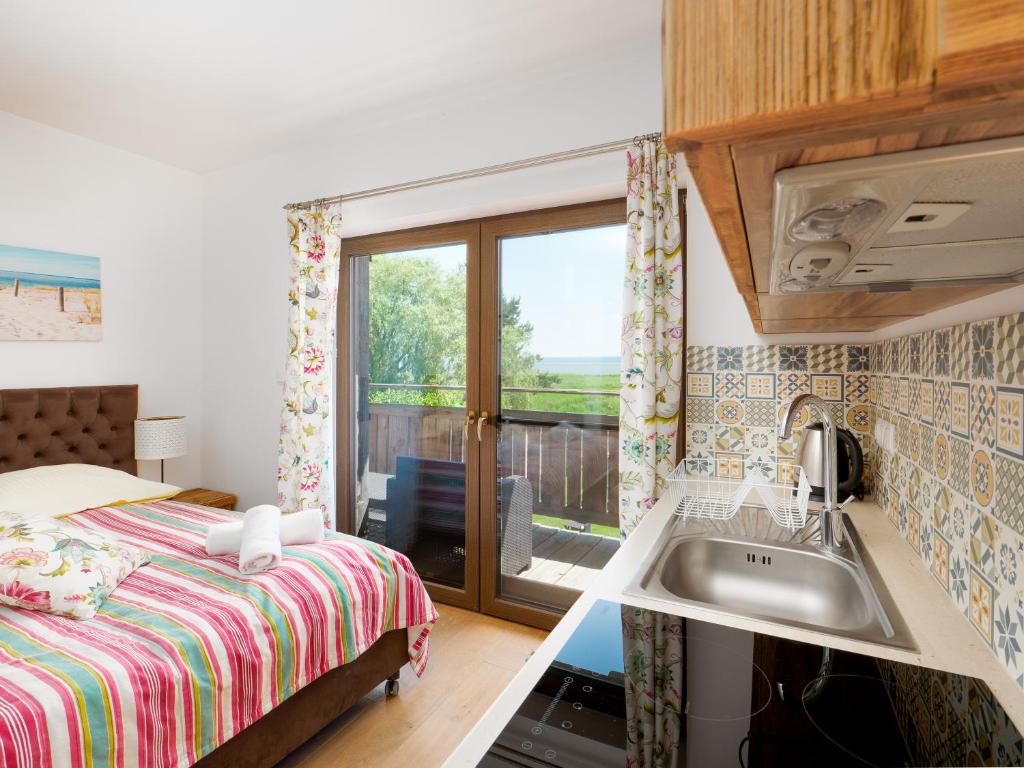 Kuchyň nebo kuchyňský kout v ubytování Hotel Aparthotel Baltic Willa