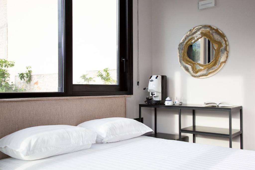 Postel nebo postele na pokoji v ubytování Garden Inn