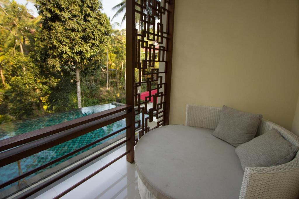 A seating area at Labak River Hotel by EPS