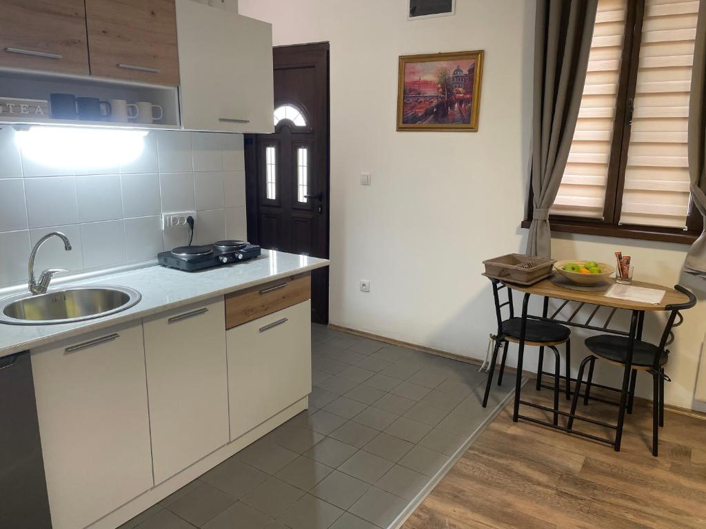Kuchyň nebo kuchyňský kout v ubytování Apartman Una