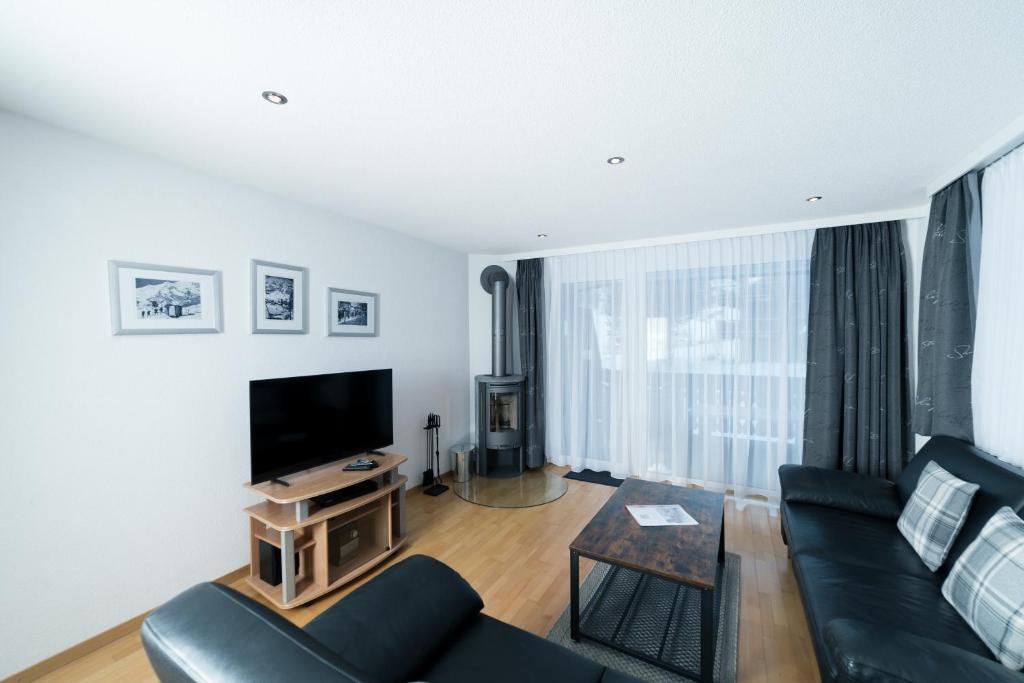 TV a/nebo společenská místnost v ubytování Haus Shangri-La