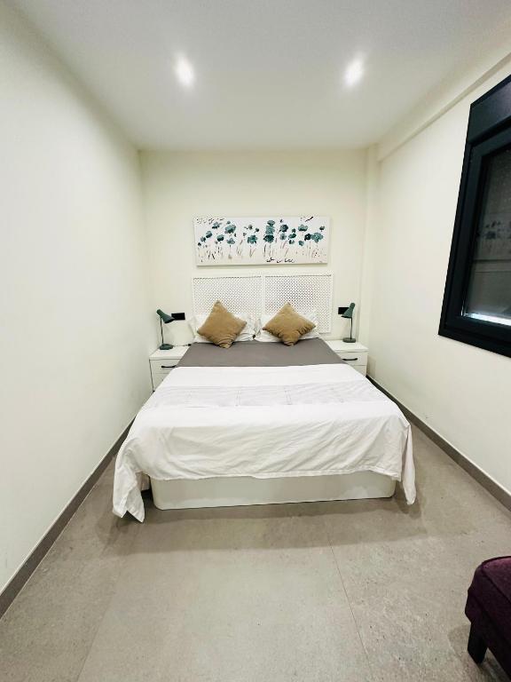 Ένα ή περισσότερα κρεβάτια σε δωμάτιο στο private room in the central beach of estepona