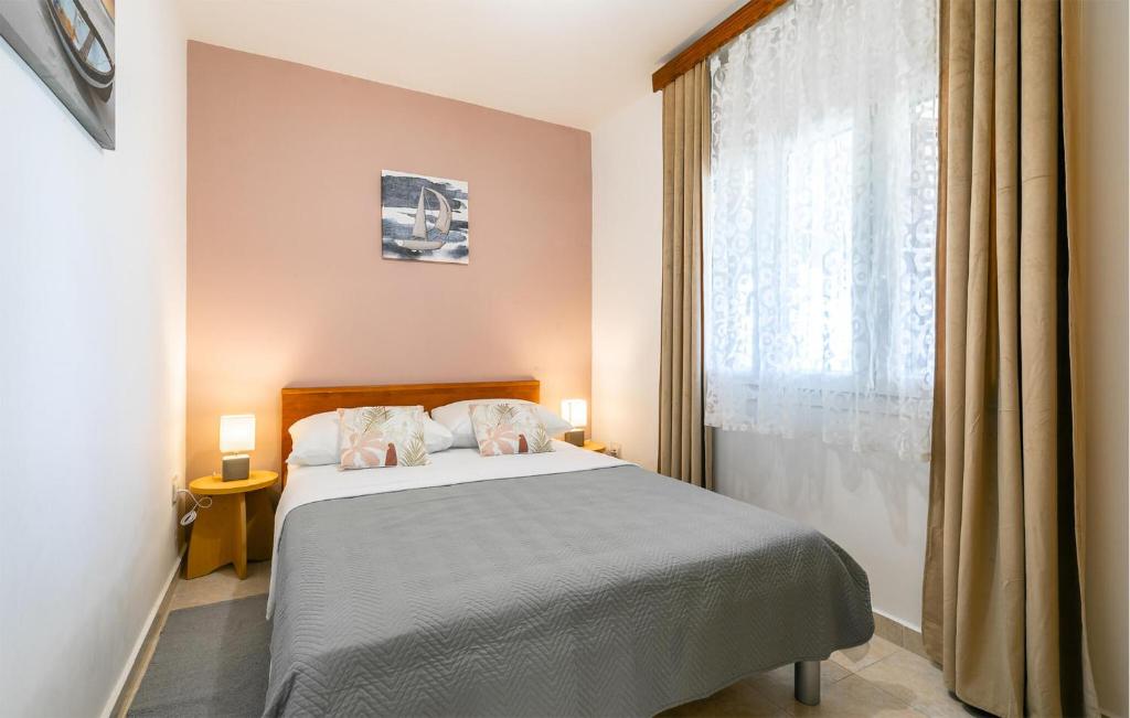 Łóżko lub łóżka w pokoju w obiekcie Holiday Home Prizba 43