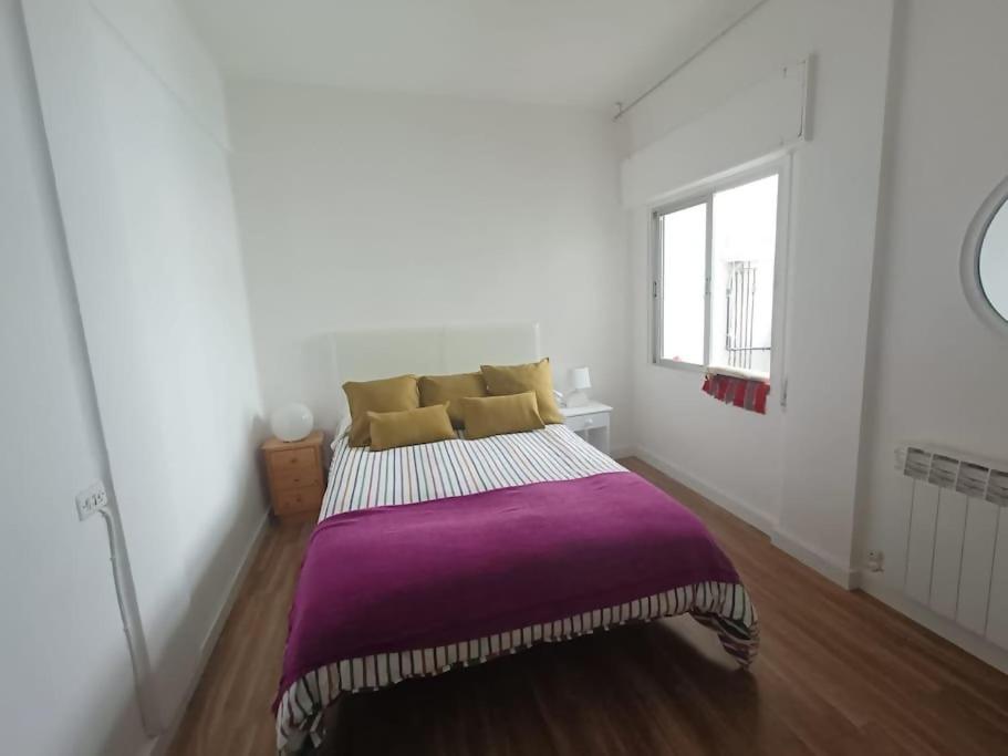 En eller flere senge i et værelse på Amplio alojamiento guerrilleros centro