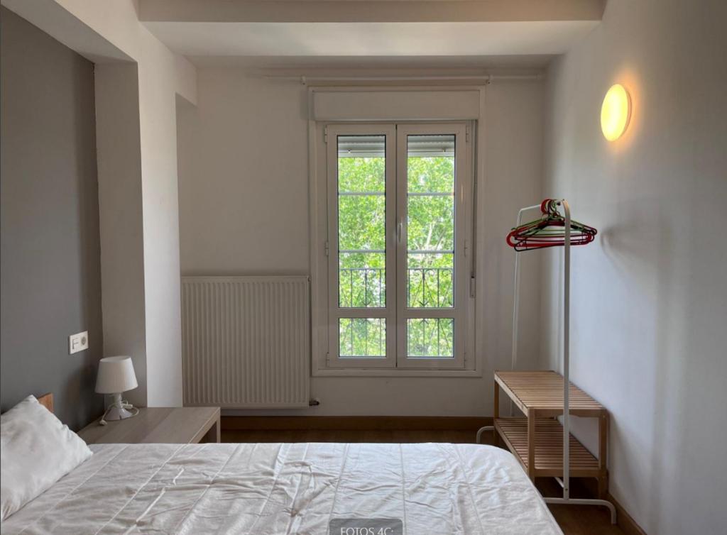 Postel nebo postele na pokoji v ubytování APARTAMENTO LABEGAIN 2