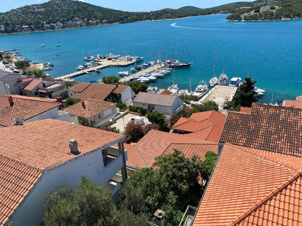 a view of a harbor with boats in the water at SEASPRAY APARTMENTS TISNO in Tisno