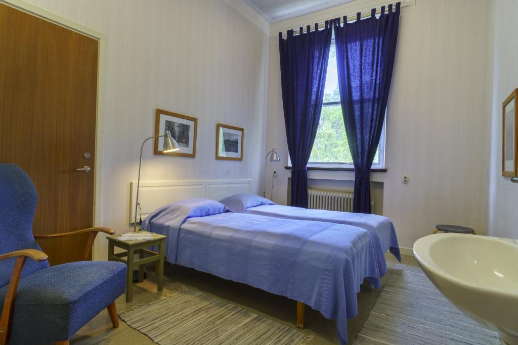 Postel nebo postele na pokoji v ubytování Kustleden Vandrarhem