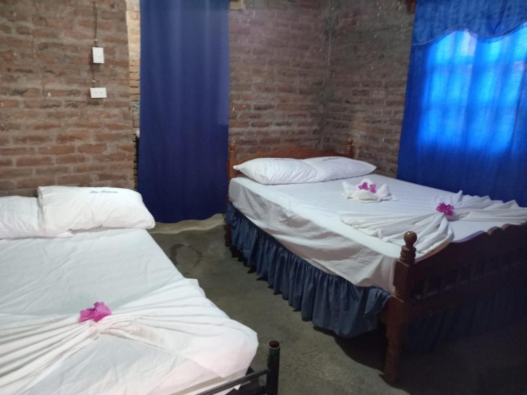 Postel nebo postele na pokoji v ubytování Hostal Y Restaurante El Escondite