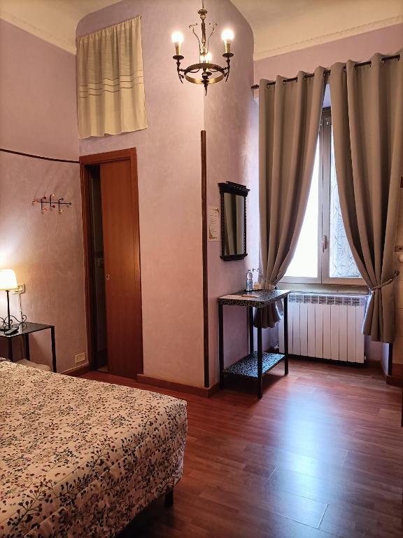 Postel nebo postele na pokoji v ubytování Rossi Hotel