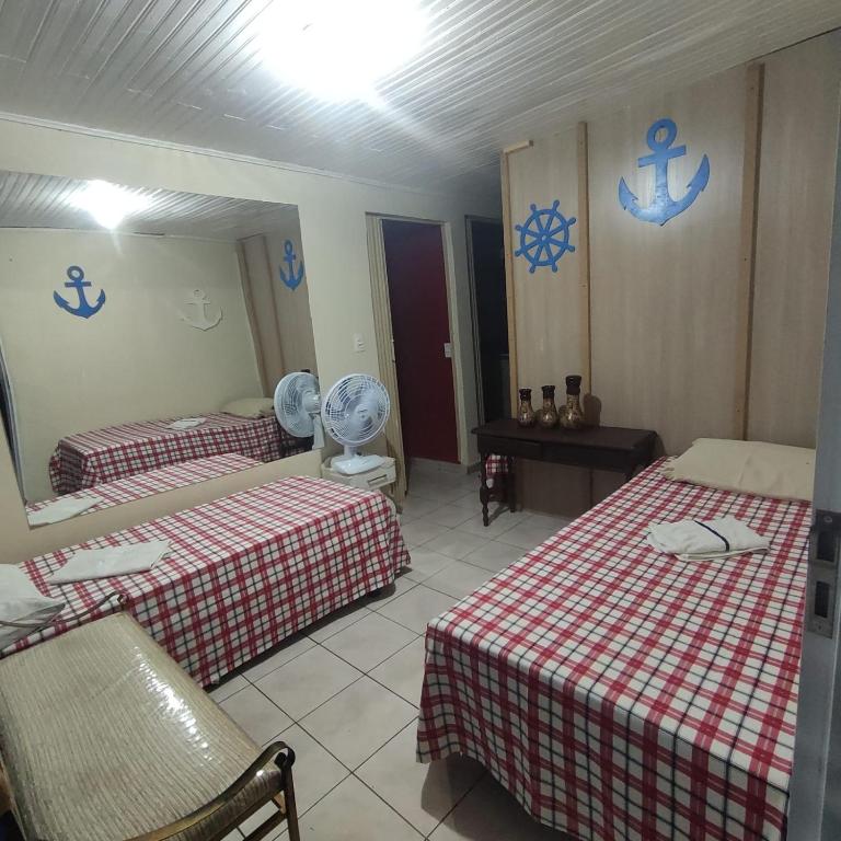Postel nebo postele na pokoji v ubytování Pousada Apucarana - Filial