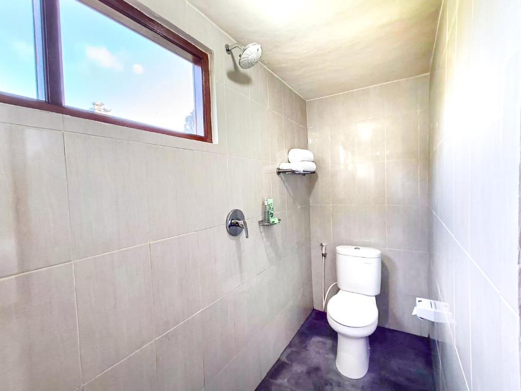 Koupelna v ubytování Wisuda Guest House