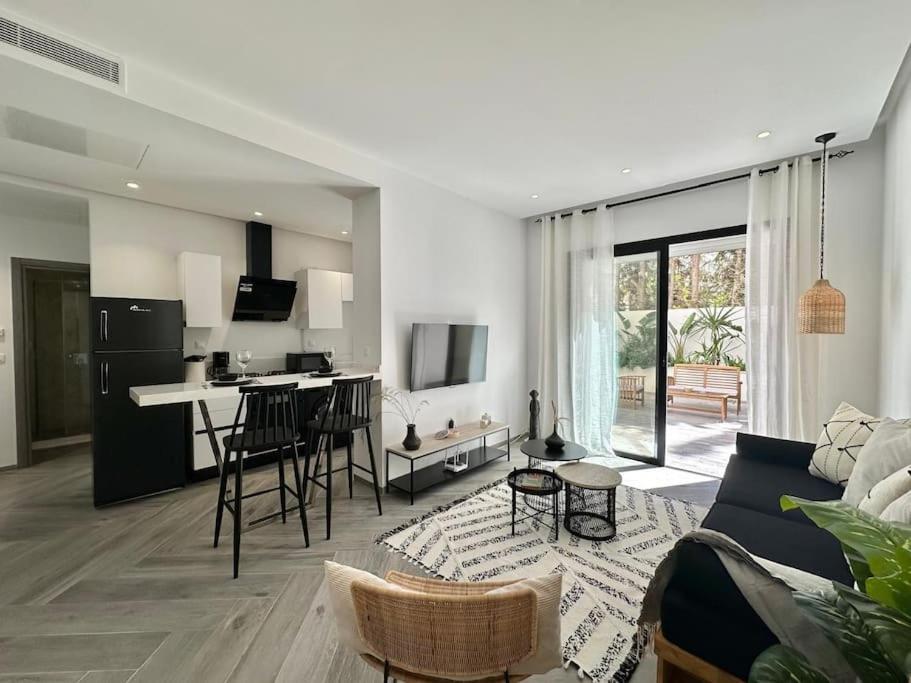 TV a/nebo společenská místnost v ubytování Hermès Appartement
