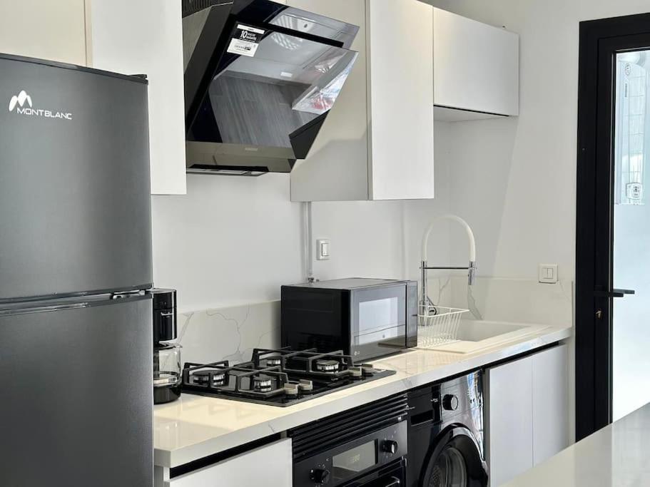 Kuchyň nebo kuchyňský kout v ubytování Hermès Appartement
